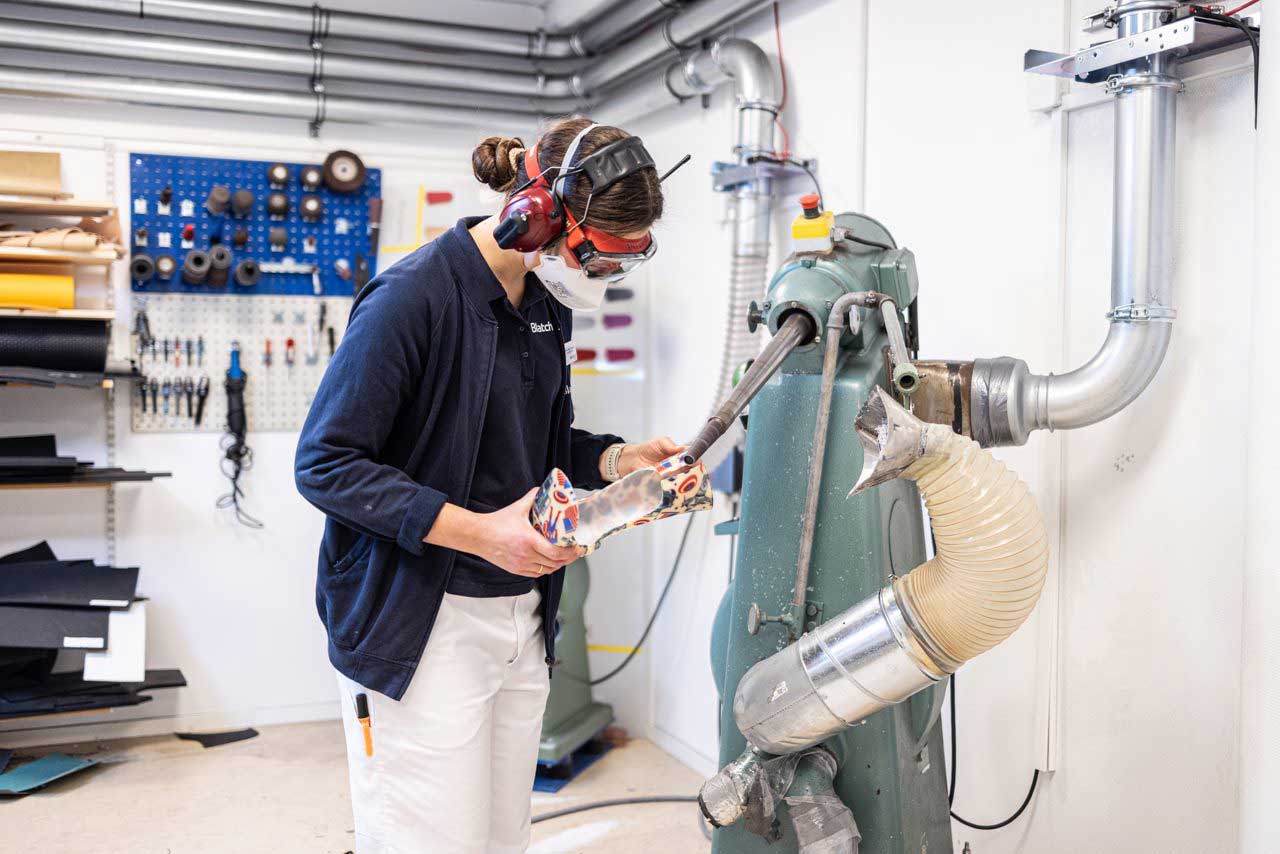Technician Adjusting A Mold (1)