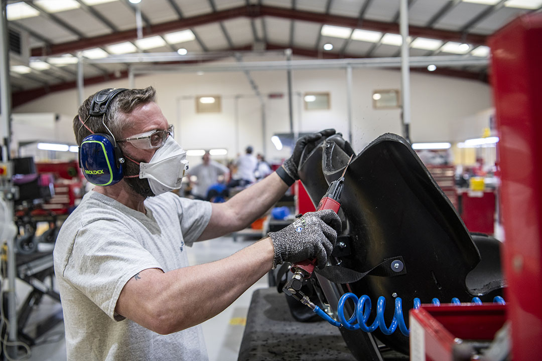 Technician moulding a wheelchair